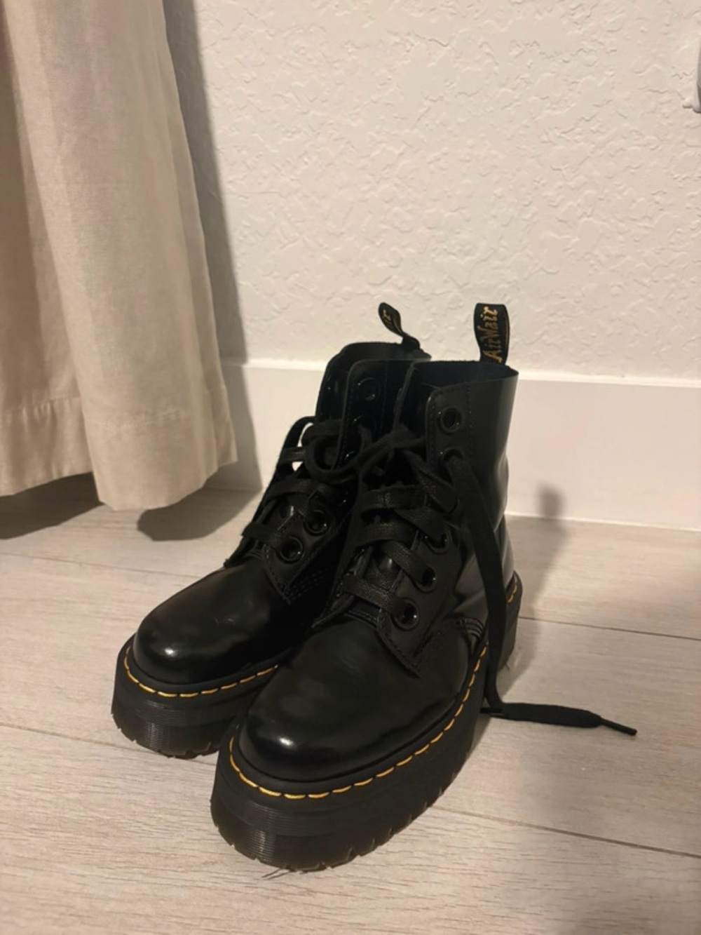 Dr. Martens Molly Black Platform Lace-Up Boots with Yellow Stitching